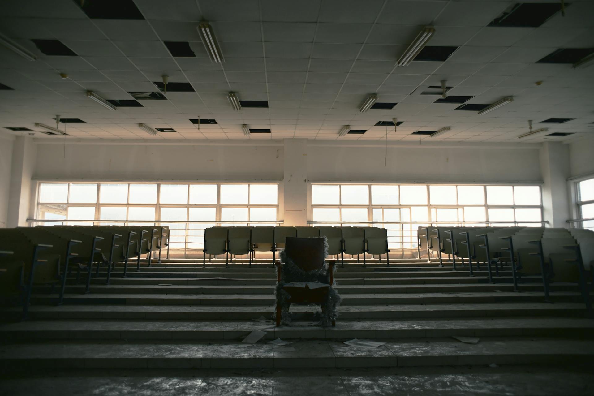 An abandoned lecture hall with rows of empty seats